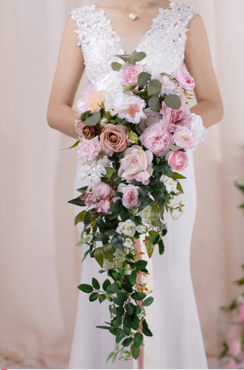 Cascading bridal bouquet with pink roses and greenery