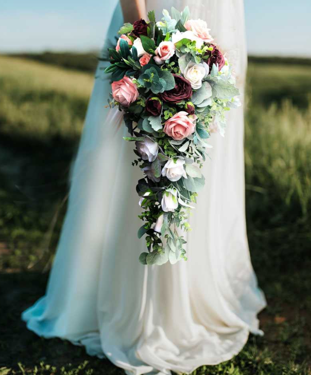 Cascading bridal bouquet with blush and burgundy roses